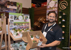 Steve Young with MODA Concrete next to the mini-gardens with mini-succulents while holding the travel box, also for mini-succulents.